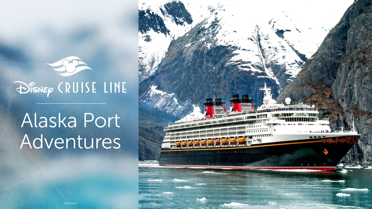 Disney cruise line ship docked in an Alaskan port surrounded by scenery