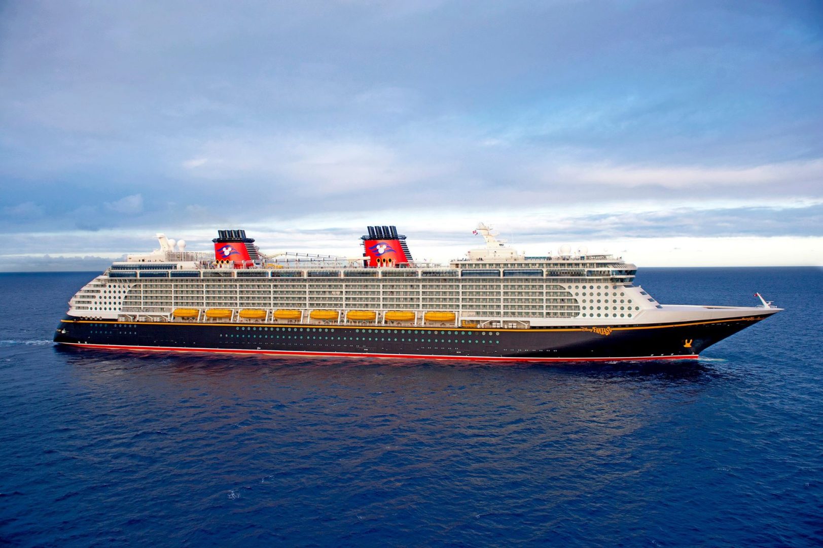 Disney Fantasy cruise ship at sea — DCL Aon travel insurance and the 75% future cruise credit explained